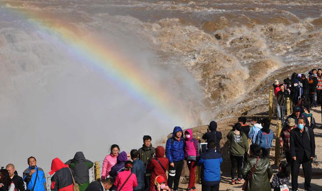 Tourists visit Hukou Waterfall of Yellow River