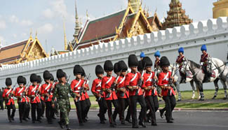 King Bhumibol takes final journey to Grand Palace, grieving Thais seeing him off